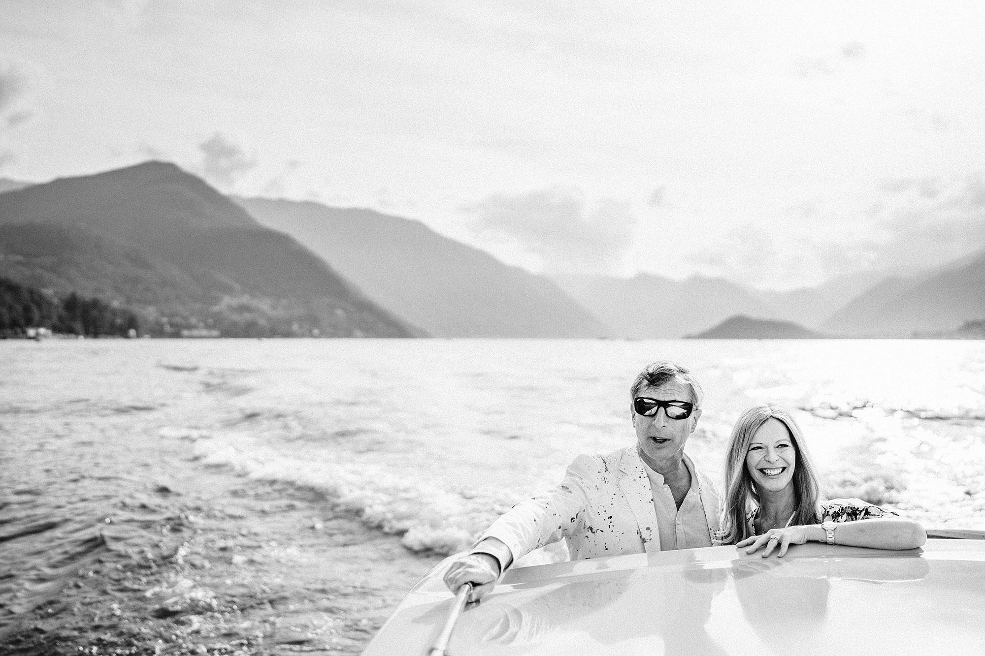 happy couple on lake como during boat ride
